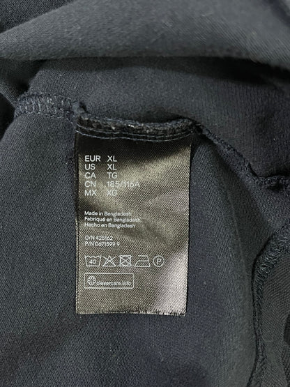 Etiqueta interior de cuidados talla XL