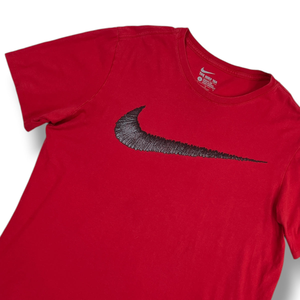 Foto original: detalle de logo Nike Swoosh negro