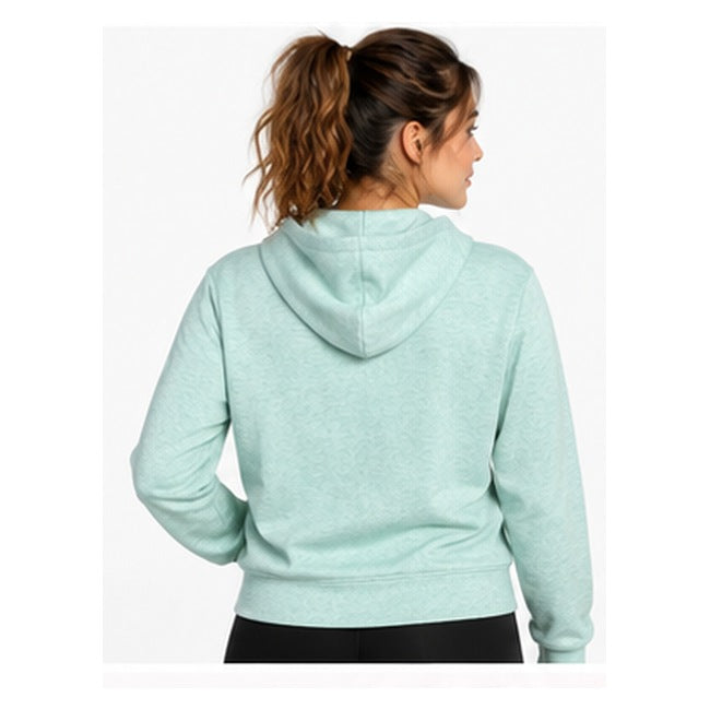 Foto referencial mujer con polerón 32 Degrees Cool verde menta 1:1, espalda