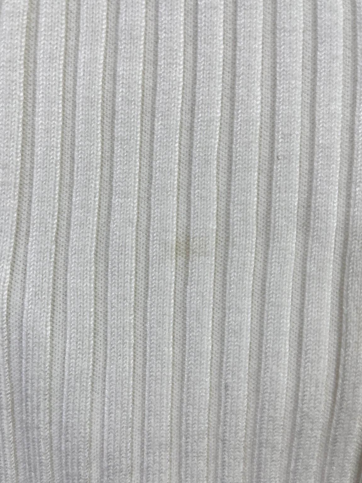 Detalle del tejido blanco invierno y estado de la prenda