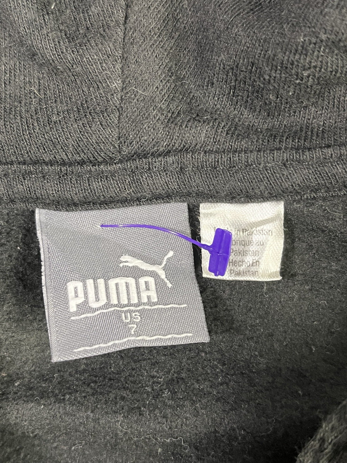 Fotografía real de etiqueta Puma talla US 7.