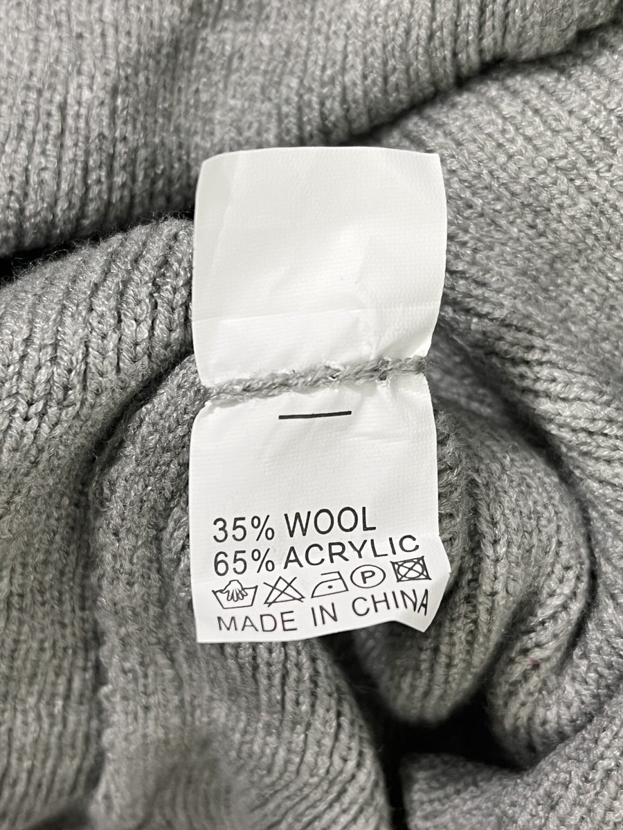 Foto real etiqueta composición 35% lana 65% acrílico y origen China