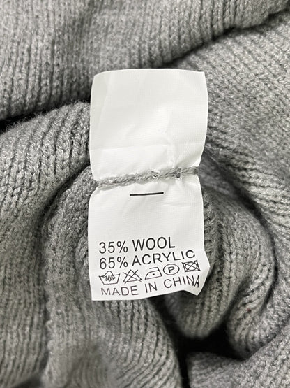 Foto real etiqueta composición 35% lana 65% acrílico y origen China