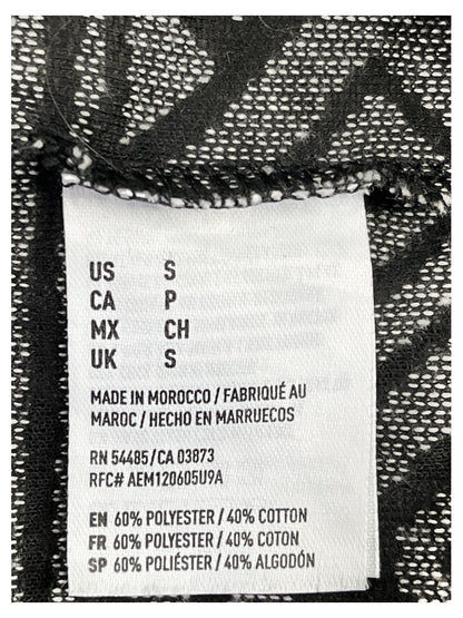 Etiqueta original talla S y composición 60% poliéster, 40% algodón, fabricado en Marruecos