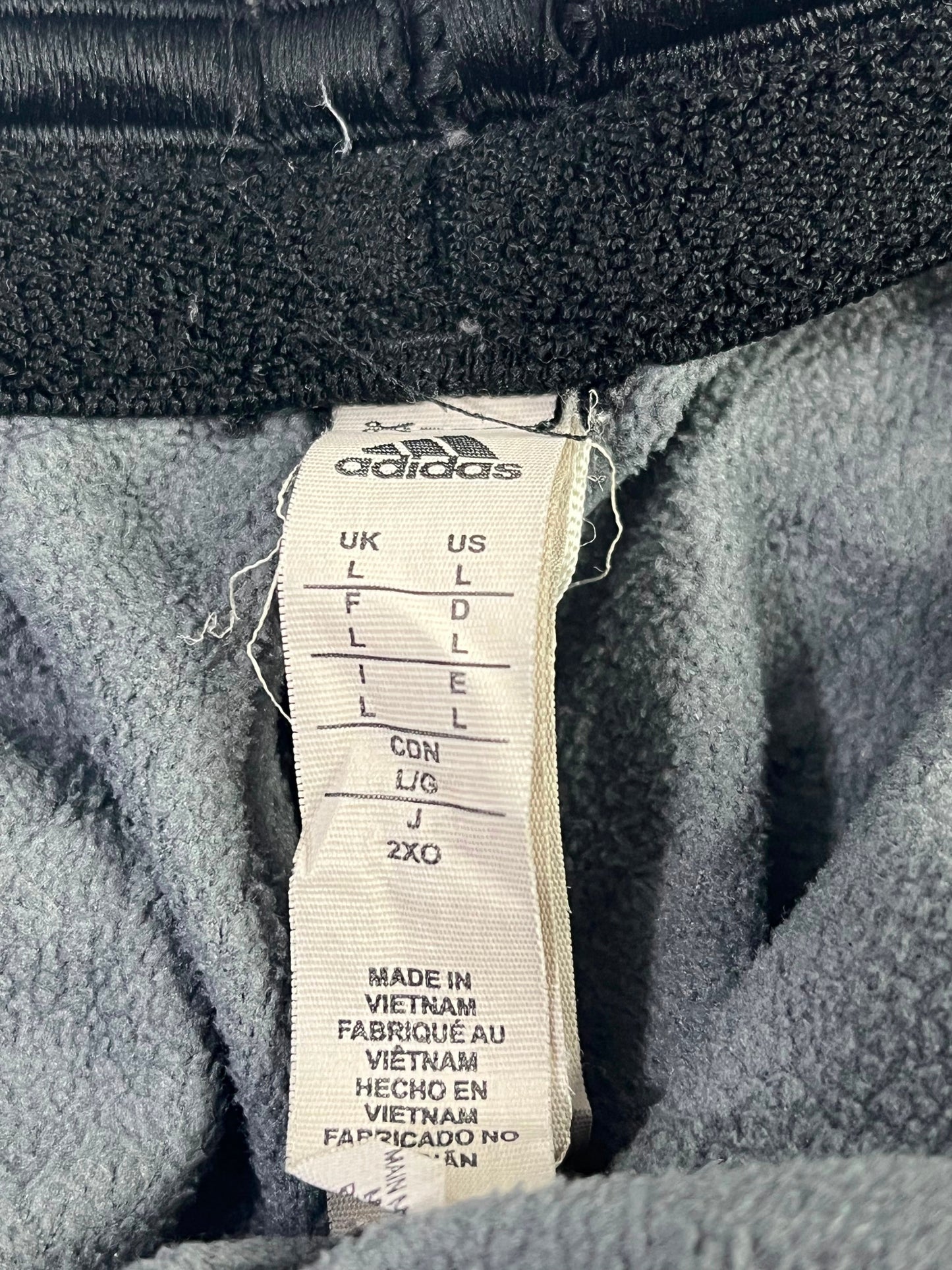 Pantalón de buzo Adidas gris jaspeado Talla L